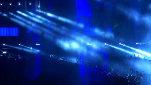 Energetic Music Event with Dynamic Blue Lights