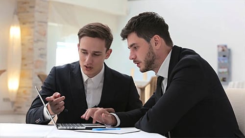 Businessmen Meeting With Using a Laptop