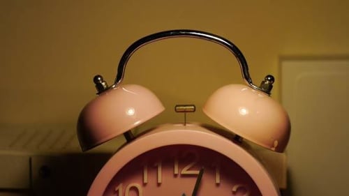 Close Up of a Pink Alarm Clock