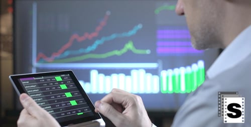 Financial Analyst Using Tablet