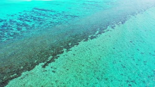 Wide angle aerial island view of a summer white paradise sand beach and turquoise sea background in