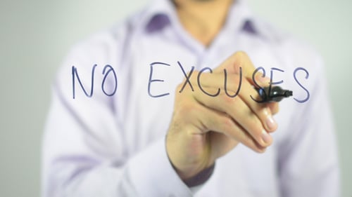 No Excuses Message Written on Clear Surface