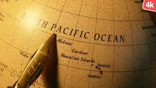 Golden Pen Points to North Pacific Ocean on Globe