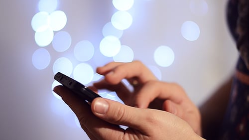 Woman Using Touch Screen Smartphone
