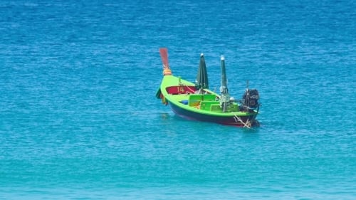 Colourful Longtail Boat Moored in Tropical Ocean