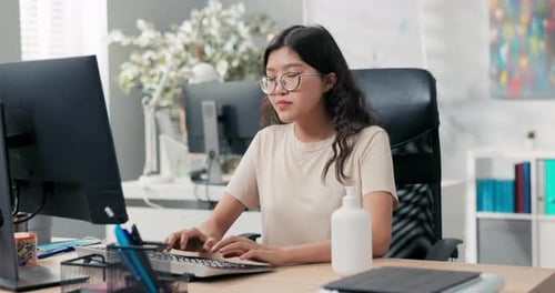Woman Disinfects Hands in Office Before Starting Computer Work Taking Care of Hand Hygiene