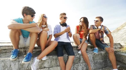 Happy Young Adults Chatting and Laughing Together