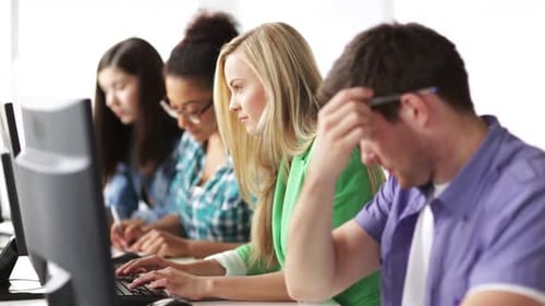 Young Adults Working on Computers in Office