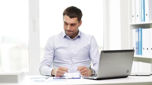 Busy Businessman With Laptop And Papers In Office 3