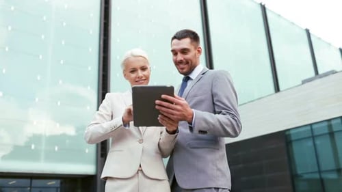 Business People Using Tablet Outside Modern Office Building