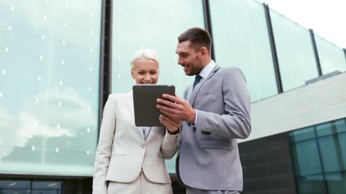 Smiling Business Team with Tablet Outside Office Building