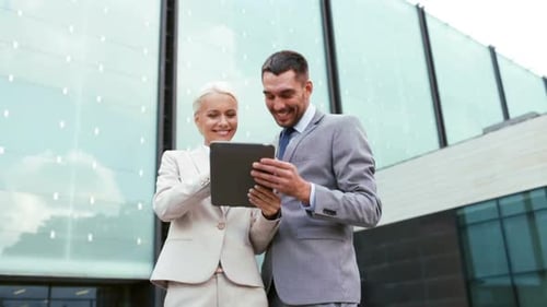 Smiling Business Team Collaborating With Tablet Outdoors