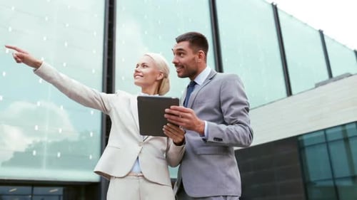 Business People Holding Tablet in Front of Building