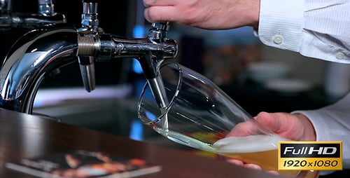 Beer is Poured From Kegs
