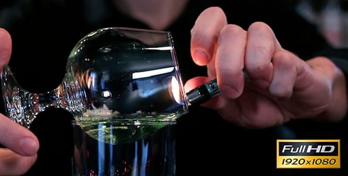 Adult Preparing Flaming Cocktail at the Bar