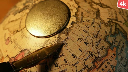 Pen Points to Russia on Vintage Globe