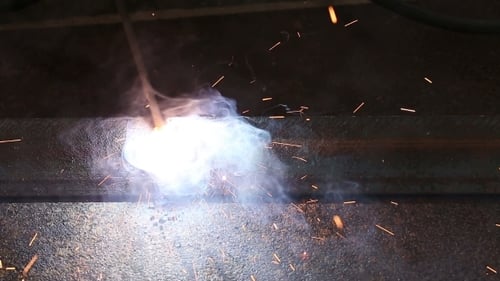 Worker Welding Metal Constructions