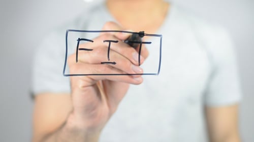 Hand writing "FIT" in block letters