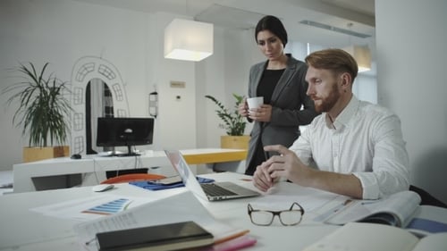 Two Employees Working In The Office
