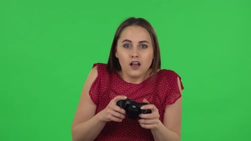 Excited Woman Playing Video Game on Green Screen