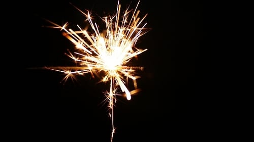 Sparkling Light Streaks on Black Background