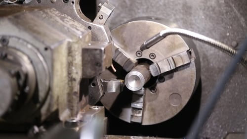 Metal Lathe Shaping Metal at Industrial Workplace