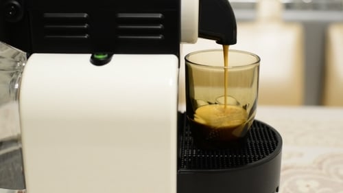Espresso Machine Pours Coffee into a Glass