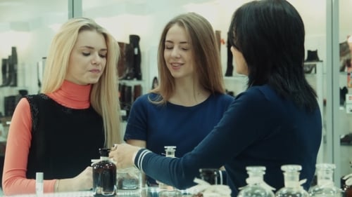 Girls Chooses Perfume In Mall