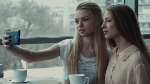 Two Girlfriends Do Selfie In Cafe