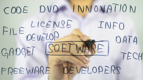 Writing Code and Tech Terms on Glass Board