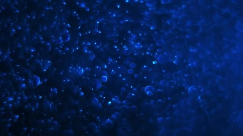 Shimmering Blue Abstract Particles Background Looping Effect