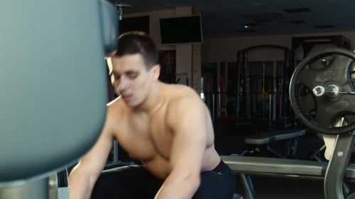 The Guy Is Engaged In a Gym On The Exercise