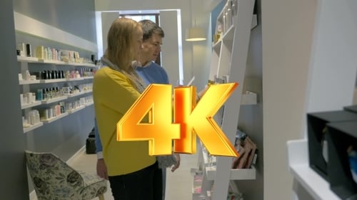 Young Couple Smelling Perfume Tester In The Shop