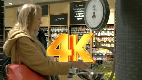 Man And Woman Weighing Cabbage