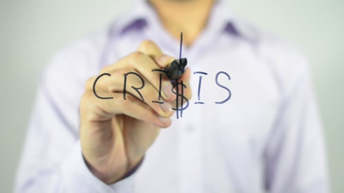 Hand Writing Crisis Concept on Clear Surface