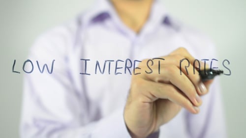 Writing Low Interest Rates on Clear Surface