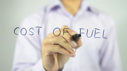 Writing the Words Cost of Fuel on Glass