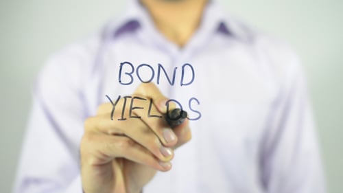 Bond Yields Written on Glass by a Person