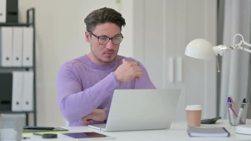 Middle Aged Man with Laptop, Thinking in Office