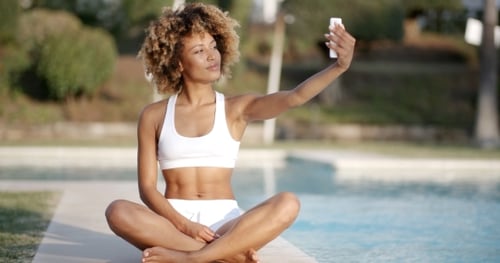 Woman Taking Selfie Near The Swimming Pool