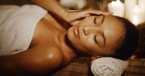 Woman Lying In Spa With Closed Eyes