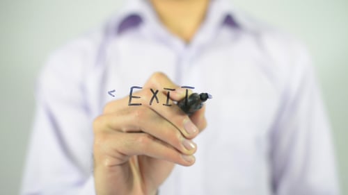 Writing the Word Exit on a White Board