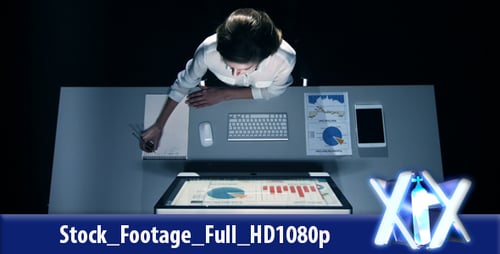 Woman Working Late at a Desk