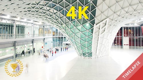 People Walking in a Futuristic Hall