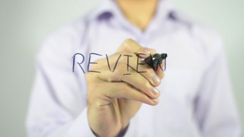Hand Writes Review on Glass Surface