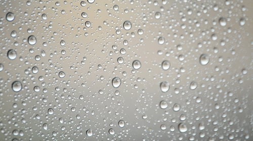 Rain Droplets on Glass: Abstract Weather Background