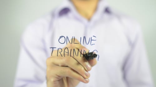 Writing 'Online Training' on a Clear Surface