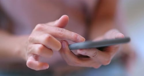 Close up Woman use of mobile phone