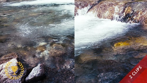 Waterfall Flowing Over Rocks in Natural Setting