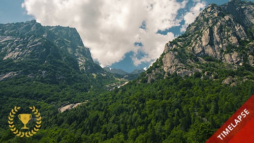 Majestic Mountains and Verdant Greenery Under Blue Sky